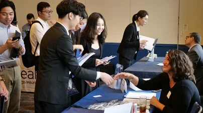 SPS students shake hands at the Career Fair